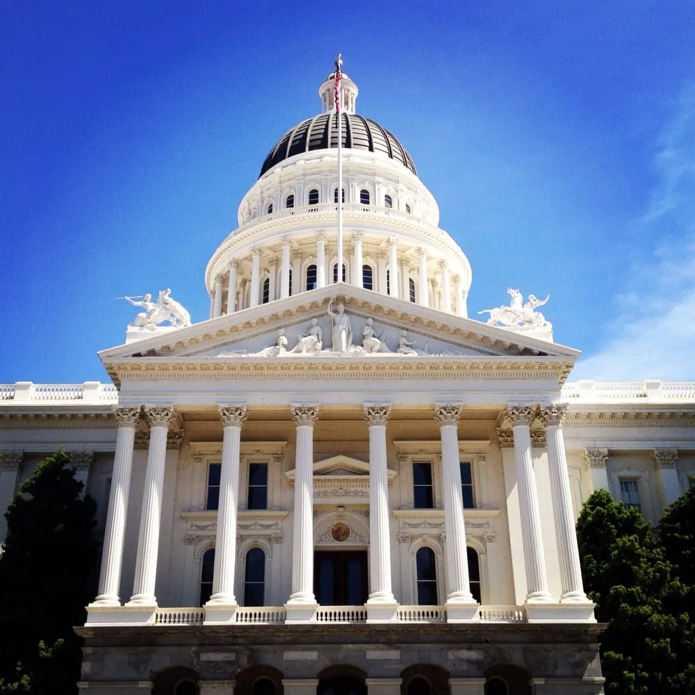The California State Capitol dome in Sacramento against a clear blue sky — Odin Systems provides mobile surveillance and city-wide video security across the Sacramento region.